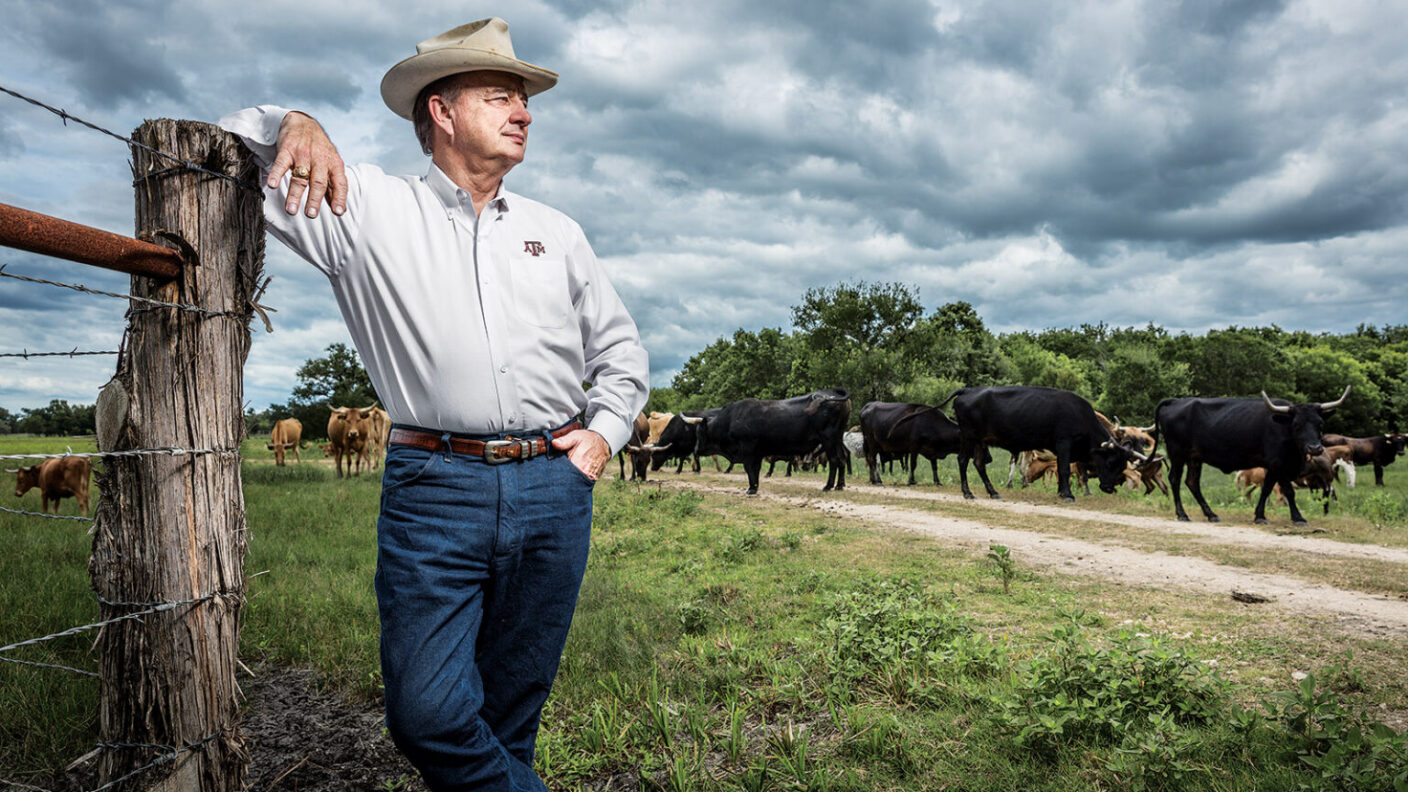 John Sharp from Texas A&M standing on a ranch