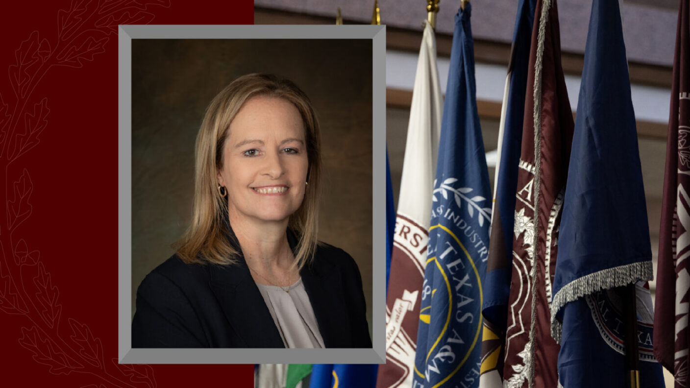 A cropped headshot of Executive Vice Chancellor Tracy Foster on a background photo of the Texas A&M University flags.