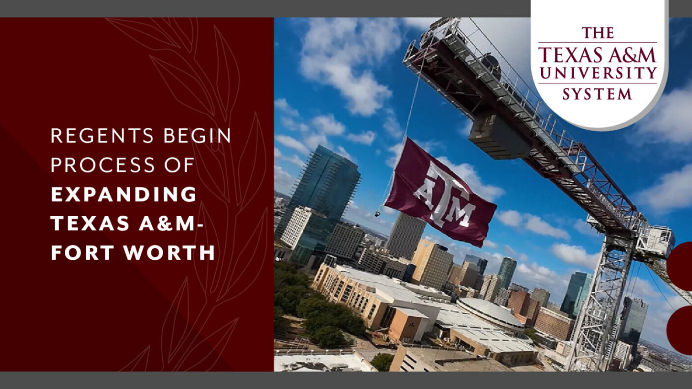 A crane carries metal with a Texas A&M flag hanging from the crane.