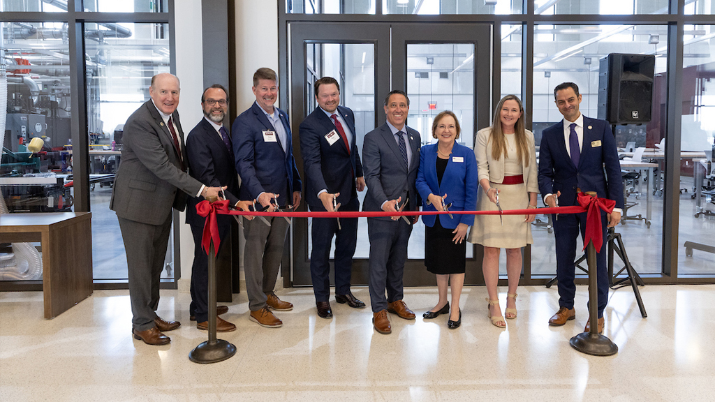 A photo of several Texas A&M University-RELLIS officials cutting a ribbon at the opening of the new STEM Education and Research Center on campus.