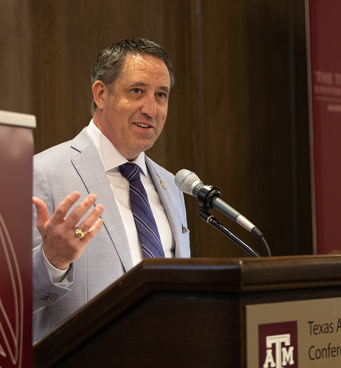 Chancellor Glenn Hegar speaking at a conference