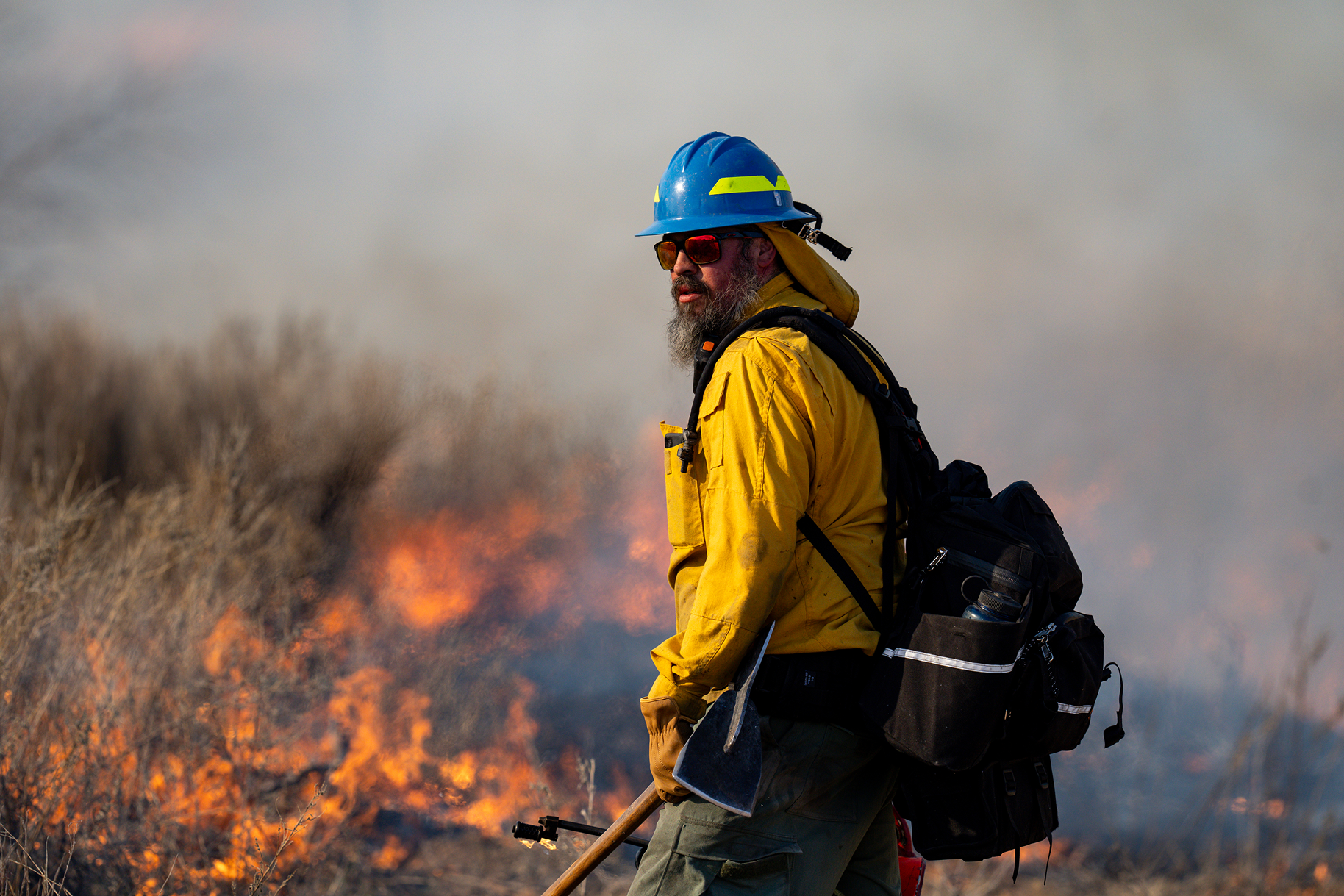 Firefighters battle parts of the reignited Smokehouse Creek fire outside of Miami, Texas.