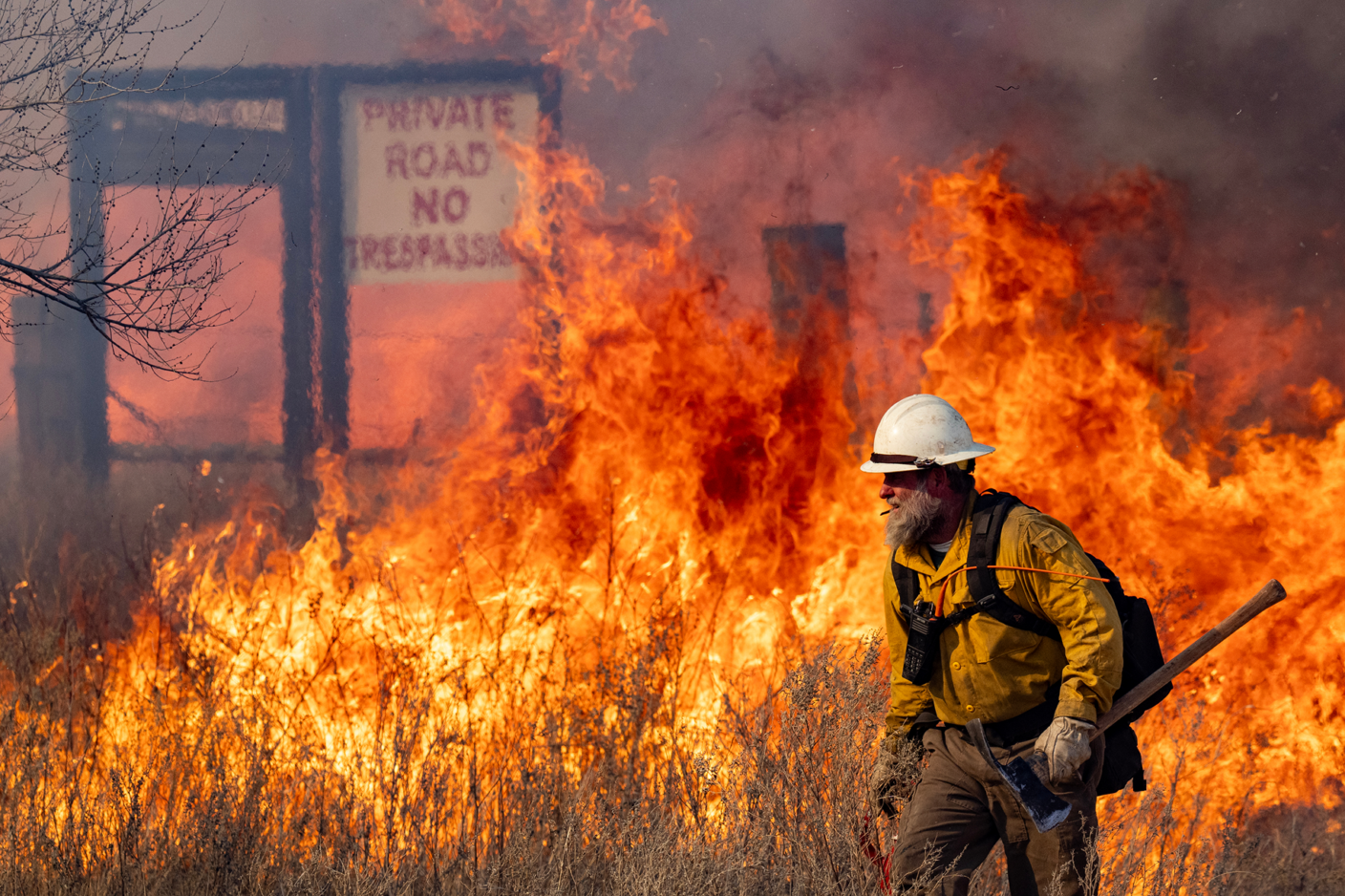 A firefighter at the scene of the Smokehouse Creek Wildfires outside Miami, Texas.